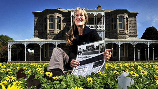 Trudi Toyne, property manager of Barwon Park Mansion, with some old newspaper stories about rabbits in Australia.