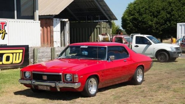 The cherry red 1975 Monaro recovered after it was stolen.