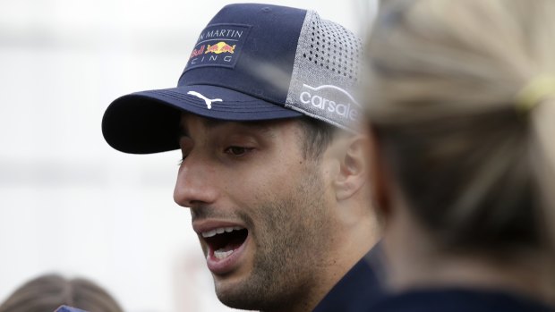 Red Bull driver Daniel Ricciardo, of Australia, answers questions from reporters after a disastrous end to his race.