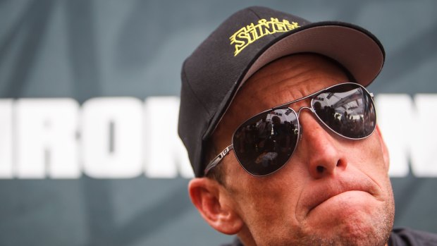 Lance Armstrong listens during a news conference in Galveston, Texas  in 2012.