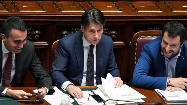 Italian PM Giuseppe Conte is flanked by Interior Minister Matteo Salvini, right, and Labour Minister Luigi Di Maio.