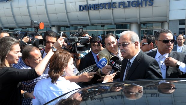 Egyptian Prime Minister Sherif Ismail talks to reporters at Cairo International Airport, Thursday, May 19, 2016. He said it was too early to say whether a technical problem or a terror attack caused the plane to crash. "We cannot rule anything out," he said. An EgyptAir flight from Paris to Cairo with 66 passengers and crew on board crashed in the Mediterranean Sea early Thursday morning, Egyptian aviation officials said. (AP Photo/Selman Elotefy)