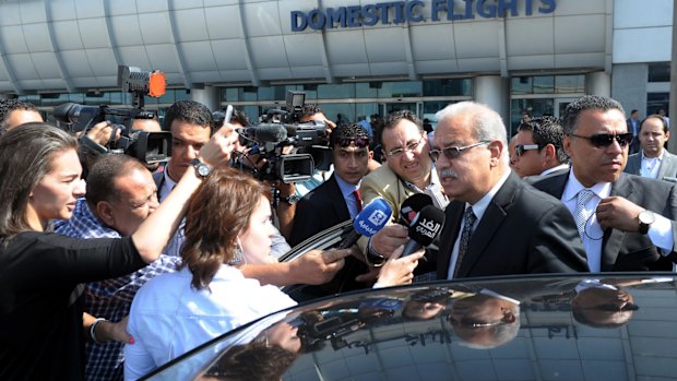 Egyptian Prime Minister Sherif Ismail talks to reporters at Cairo International Airport, Thursday, May 19, 2016. He said it was too early to say whether a technical problem or a terror attack caused the plane to crash. "We cannot rule anything out," he said. An EgyptAir flight from Paris to Cairo with 66 passengers and crew on board crashed in the Mediterranean Sea early Thursday morning, Egyptian aviation officials said. (AP Photo/Selman Elotefy)