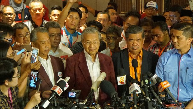 At a late-night conference, Mahathir told reporters it looked like Malaysia would have its first change in government in 61 years.