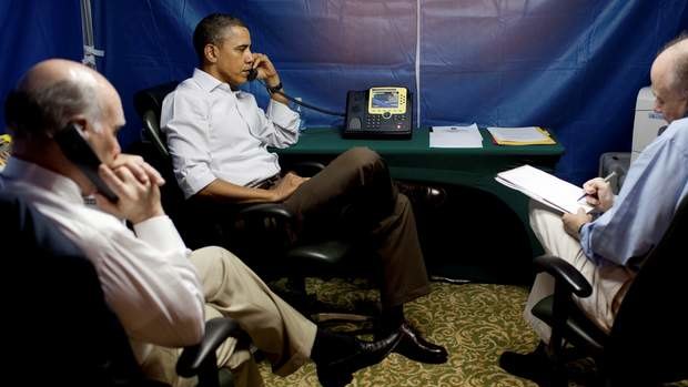 President Barack Obama is briefed on the uprising in Libya during a conference call inside a secure tent setup near his hotel suite in Rio de Janeiro, March 20, 2011.
