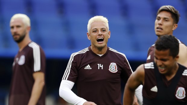 Relaxed and ready: Mexico players train before their clash against Brazil.