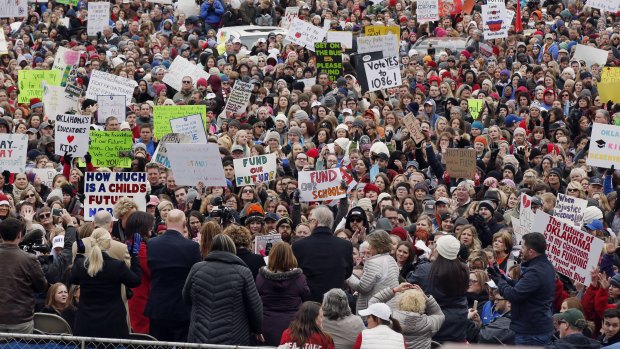 The crowd cheers during a teacher rally at the state Capitol in Oklahoma City.
