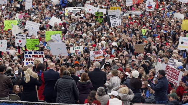 The crowd cheers during a teacher rally at the state Capitol in Oklahoma City.