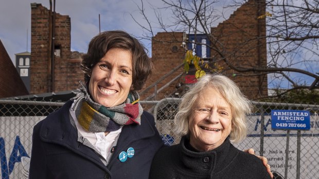 La Mama Theatre company manager Caitlin Dullard and artistic director Liz Jones outside the Faraday Street building, which will be rebuilt.