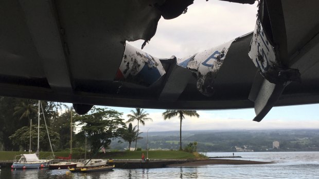 The tour boat after an explosion sent lava flying through it roof, off the Big Island of Hawaii .