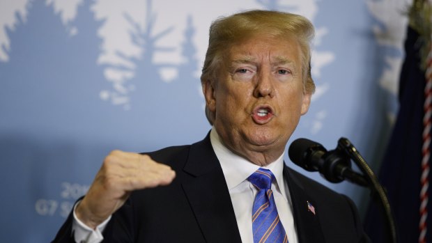 President Donald Trump speaks during a news conference at the G7.