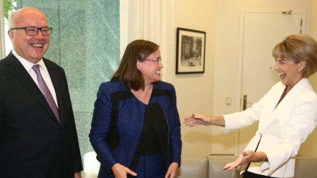 Minister for Women Michaelia Cash congratulates Kate Jenkins on her announcement as the new Sex Discrimination Commissioner with Attorney-General George Brandis at Parliament House on Thursday.