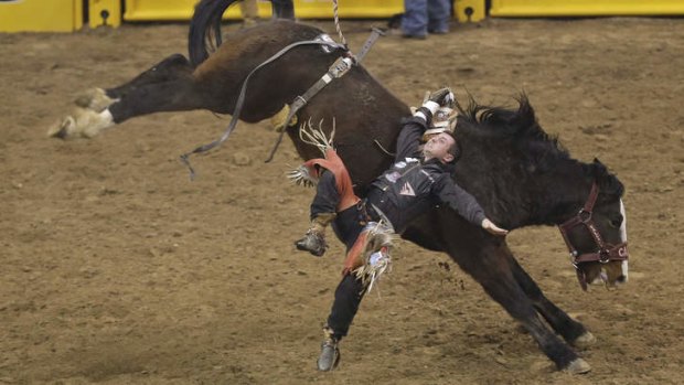 Rugh ride ... Jared Keylon of Uniontown, Kansas is thrown by Wild and Blue while competing in the bareback riding event of the US National Finals Rodeo in Las Vegas.