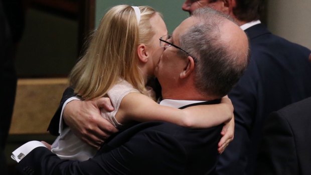 Treasurer Scott Morrison is hugged by his daughter after he gave the budget address on Tuesday.