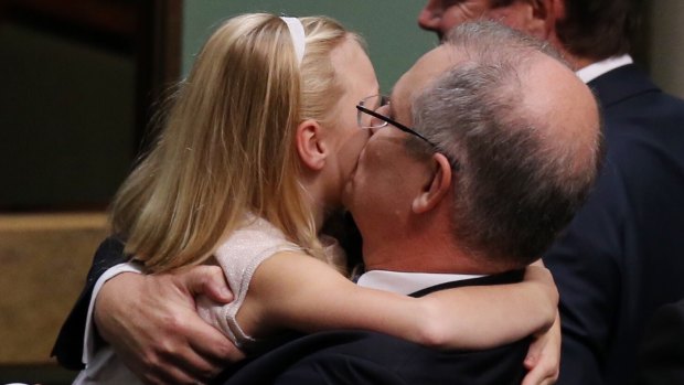 Treasurer Scott Morrison is hugged by his daughter after he gave the budget address on Tuesday.