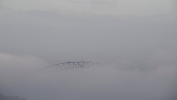 The Harbour Bridge was barely visible due to fog.