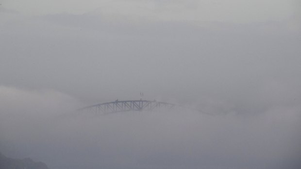 The Harbour Bridge was barely visible due to fog.