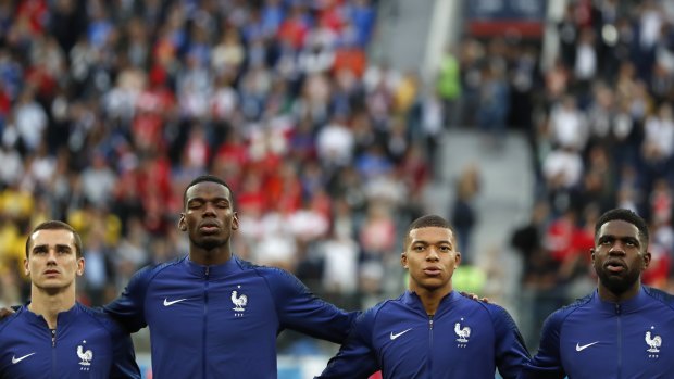 Speaking our language: Antoine Griezmann, Paul Pogba, Kylian Mbappe, and Samuel Umtiti sining the French anthem.