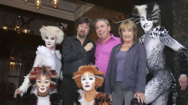 (Centre left to right) Trevor Nunn, Andrew Lloyd Webber and Gillian Lynne with performers from the musical Cats outside the London Palladium, 2014. in central London.