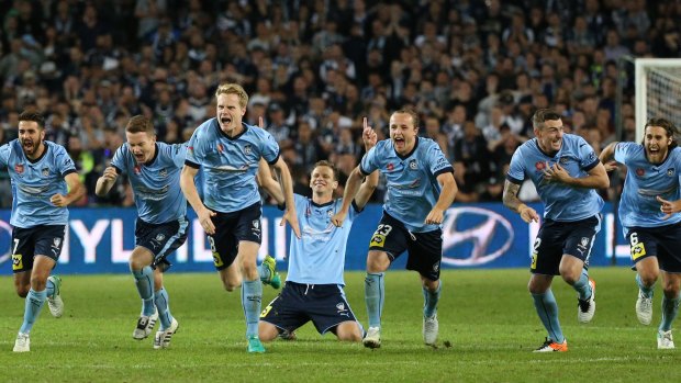 Shooting stars: Sydney FC celebrate the 2017 grand final penalty triumph over Victory.