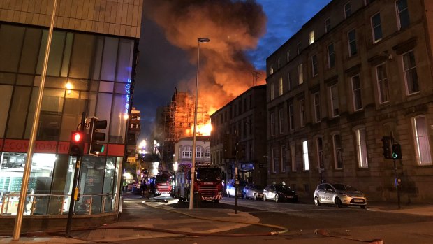 Flames and smoke rise from the Glasgow School of Art's Mackintosh Building.