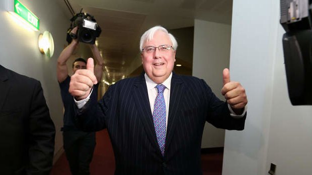 Palmer United Party leader Clive Palmer departs after addressing the media during a press conference in the press gallery. Photo: Alex Ellinghausen