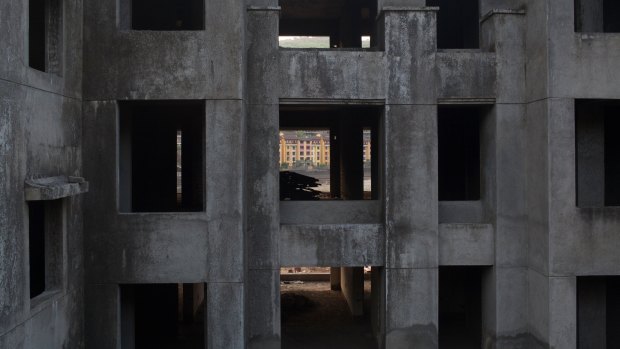 A residential building stands unfinished in Lavasa, India.