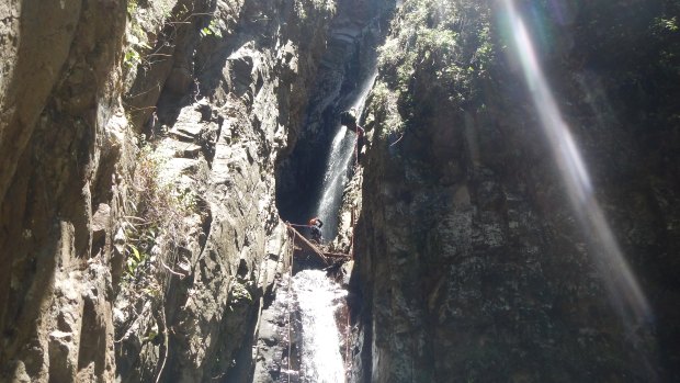 The Brisbane Bushwalkers out abseiling at Watsons Falls.