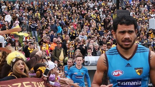 Cyril Rioli is urged on at Hawthorn training.