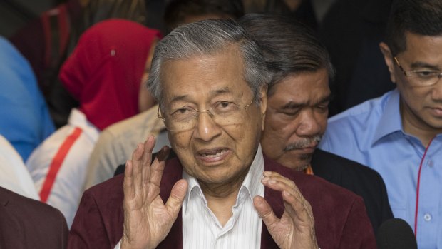 In chaotic scenes, Mahathir Mohamad told reporters that he believed his opposition alliance had won the election.