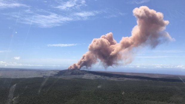 Red ash rises from the Puu Oo vent on Hawaii's Kilauea Volcano after a magnitude-5.0 earthquake struck the Big Island.