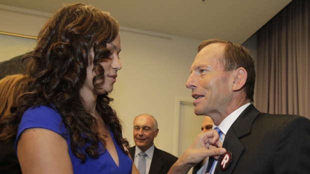 Carla McGrath, pictured with then opposition leader Tony Abbott in 2013, is deputy chair of GetUp!