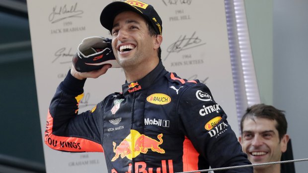 Drink from this? Daniel Ricciardo has fun with the crowd before drinking champagne from his shoe.