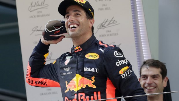 Drink from this? Daniel Ricciardo has fun with the crowd before drinking champagne from his shoe.