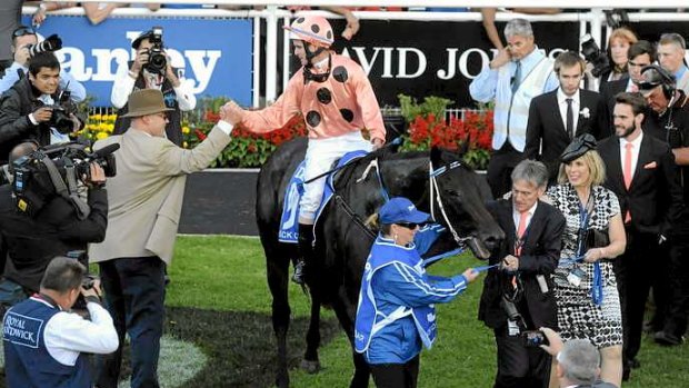 Job well done ... trainer Peter Moody and jockey Luke Nolen shake hands after Black Caviar's victory in the Group 1 TJ Smith Stakes at Royal Randwick.