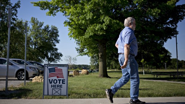 A voter arrives at a polling station in Davenport, Iowa, wehre farmer loyalty for Donald Trump looks like it's starting to waver over tariff disputes with countries that import American crops.