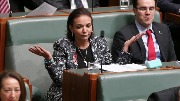 Labor MP Anne Aly listens to Prime Minister Malcolm Turnbull's response to her question.