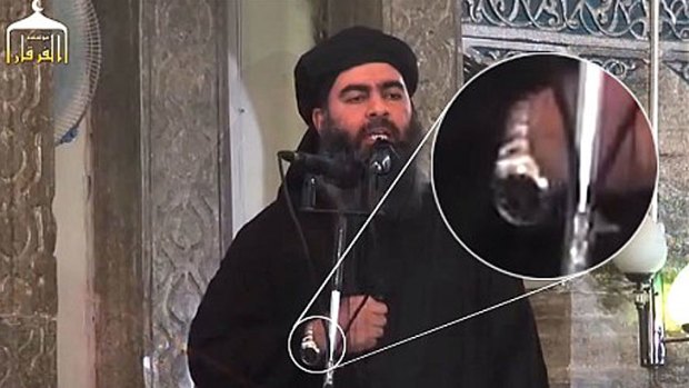 Abu Bakr al-Baghdadi shows off his watch during a reported speech at Mosul's Great Mosque.