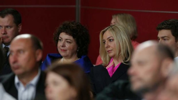 Therese Rein and Jessica watch the community forum at Rooty Hill RSL in Sydney on Wednesday.