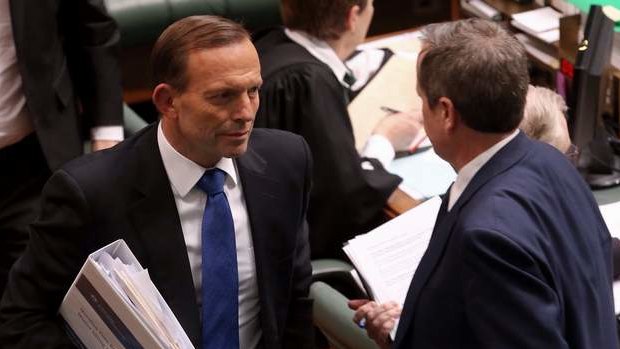 Prime Minister Tony Abbott and Opposition Leader Bill Shorten pass after a division in Parliament House. Photo: Andrew Meares