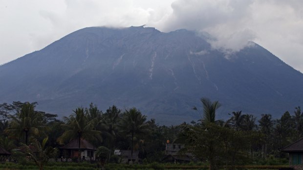 Mount Agung spews volcanic ash into the air.