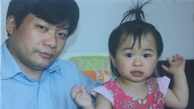 Sam Lau with his daughter. 