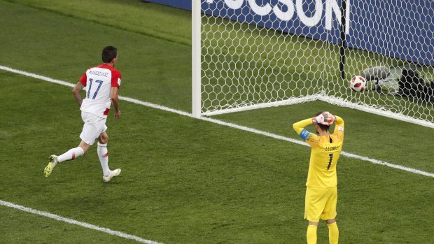 France goalkeeper Hugo Lloris reacts after Croatia's Mario Mandzukic nips in to score.