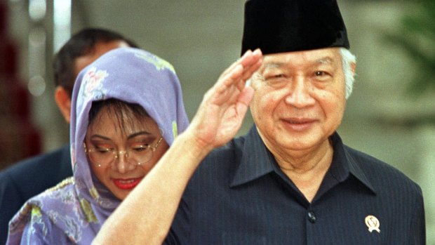Then Indonesian president Suharto, right, salutes after announcing his resignation in 1998.