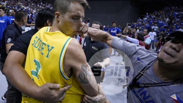 Boomers player Nathan Sobey is punched in the face during the extraordinary brawl.
