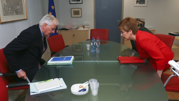 The EU chief Brexit negotiator Michel Barnier, left, and Scottish First Minister Nicola Sturgeon prepare for a meeting at EU headquarters in Brussels, last year.