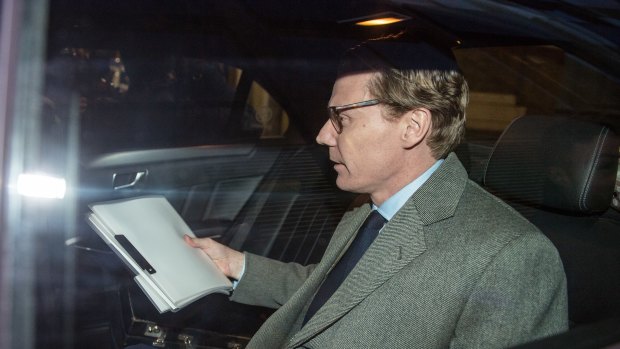 Alexander Nix, chief executive officer of Cambridge Analytica, leaves the company's offices in London.