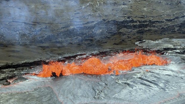 A line of spattering along a lava lake margin of the Halemaumau Crater floor, Kilauea Volcano last month.