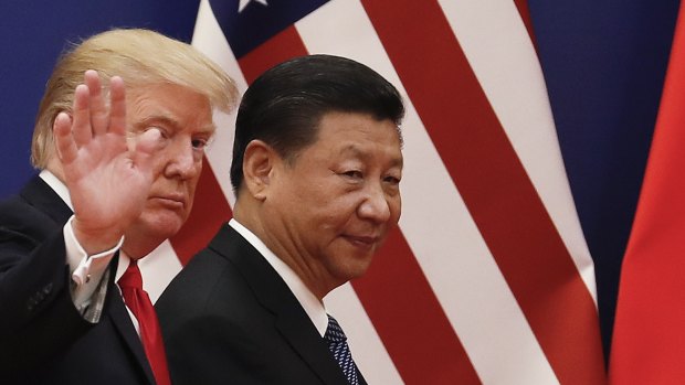 Does Trump want an economic war? The US President with his Chinese counterpart Xi Jinping after a business event in Beijing last November. 
