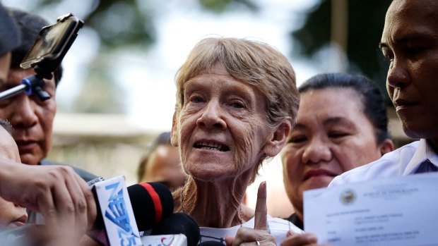 Australian missionary Sister Patricia Fox gestures as she is interviewed by reporters after she was released from custody at the Bureau of Immigration in Manila, Philippines. 